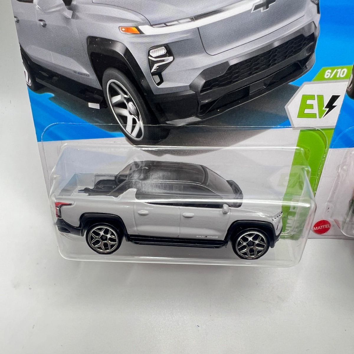 Hot Wheels Silverado EV RST Lot of 2 Silver + Orange 86/250 1:64