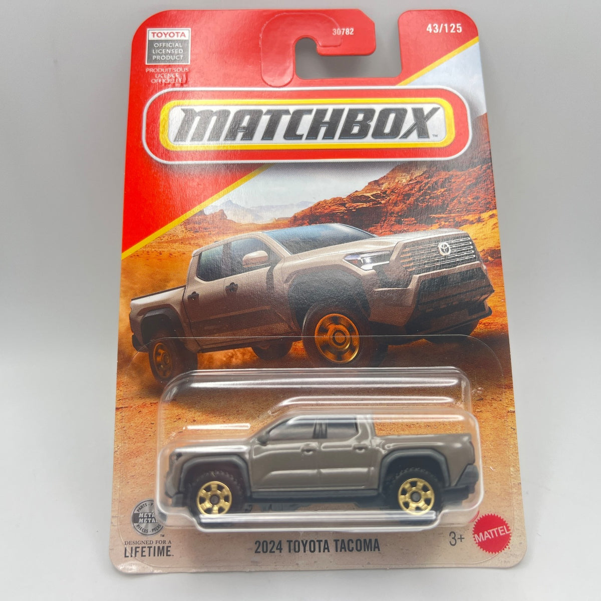 MATCHBOX 2024 TOYOTA TACOMA   2026 MAINLINE  BROWN  43/125