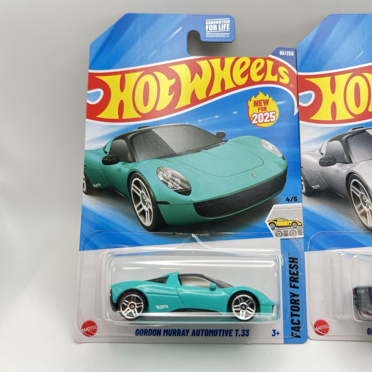 New 2025 Hotwheels Gordon Murray Automotive T.33 Lot of 2 Cars. Silver and Aqua