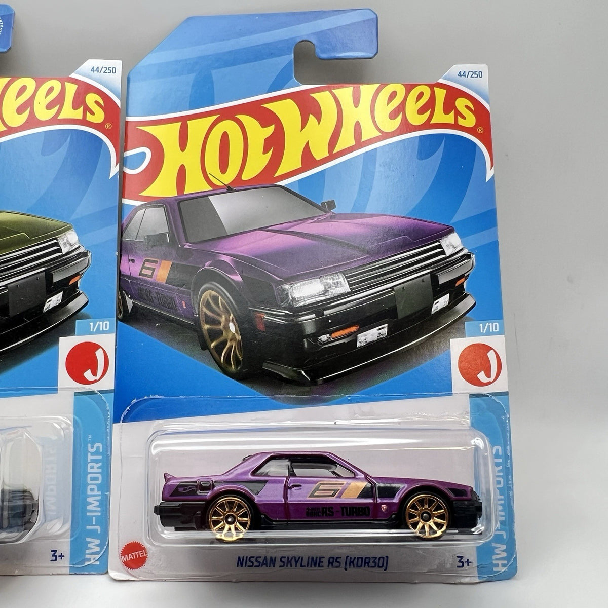 Lot of 2 - purple & green 2024 Hot Wheels Nissan Skyline RS KDR30 J-Imports jdm