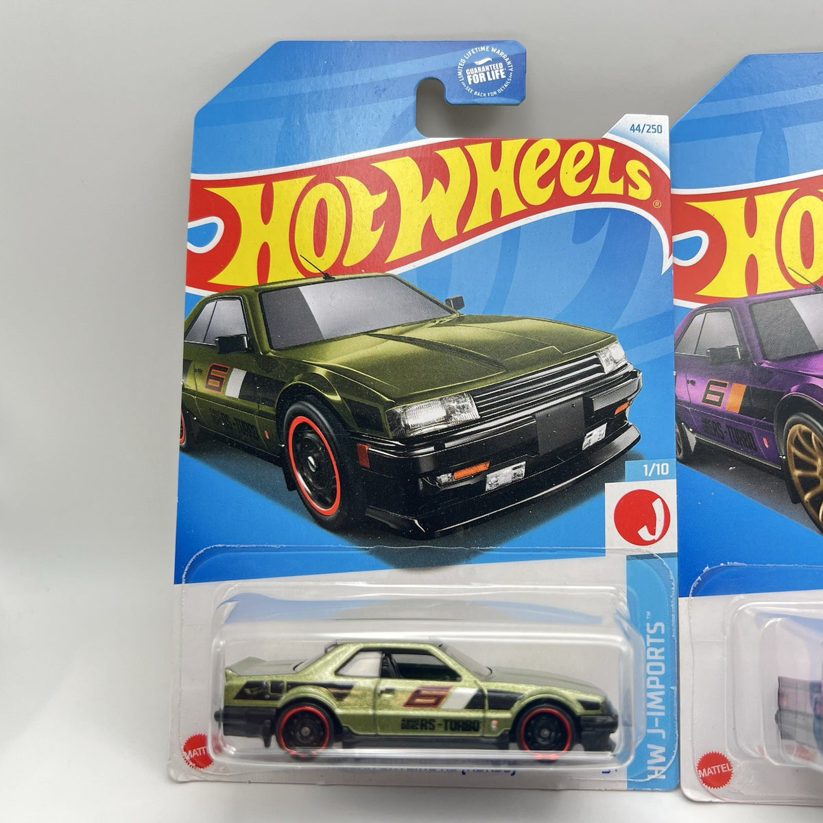 Lot of 2 - purple & green 2024 Hot Wheels Nissan Skyline RS KDR30 J-Imports jdm
