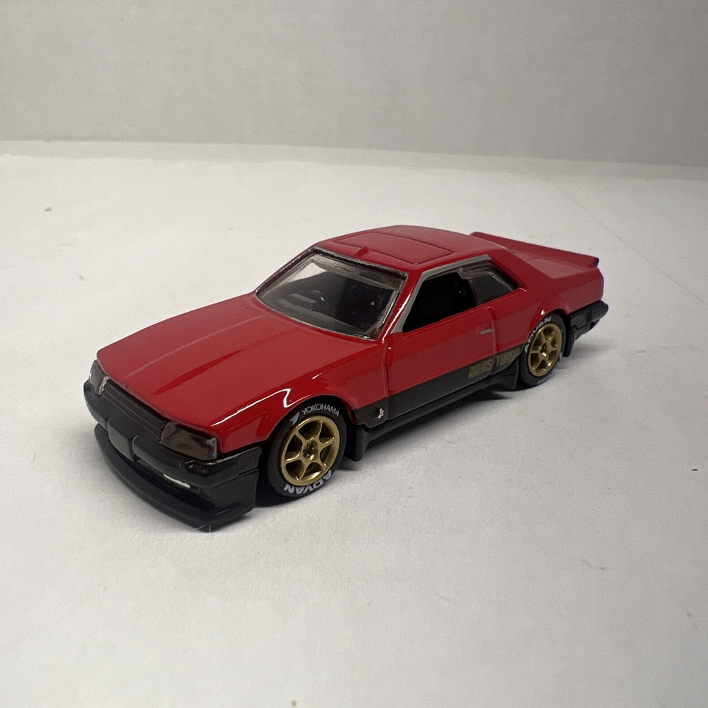 Hot Wheels 1:64 Red 1982 NISSAN SKYLINE R30 Custom with Real Riders