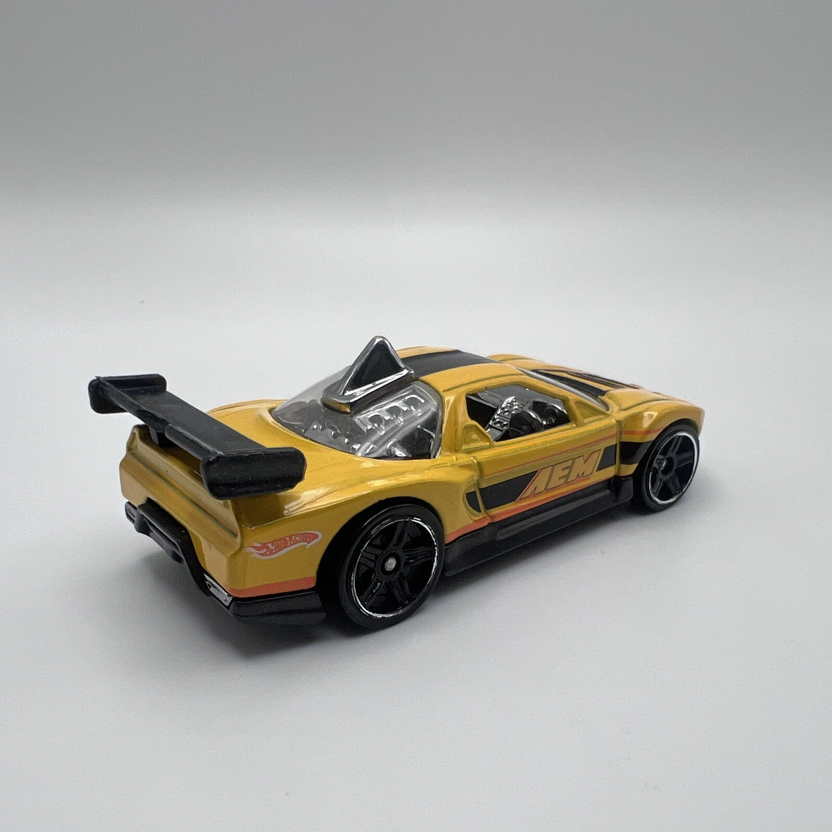 2010 HOT WHEELS ACURA NSX AEM YELLOW 1:64 DIECAST 2 7/8" CAR W/ ORANGE & BLACK