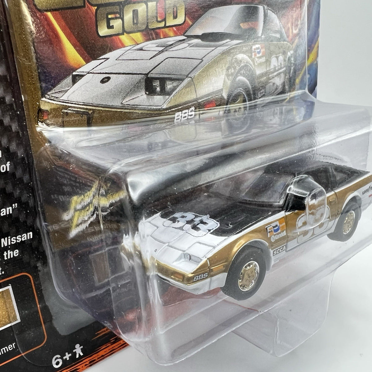 JOHNNY LIGHTNING IMPORT HEAT GT 1985 NISSAN 300ZX #33 RACE CAR GOLD/BLACK 1/64
