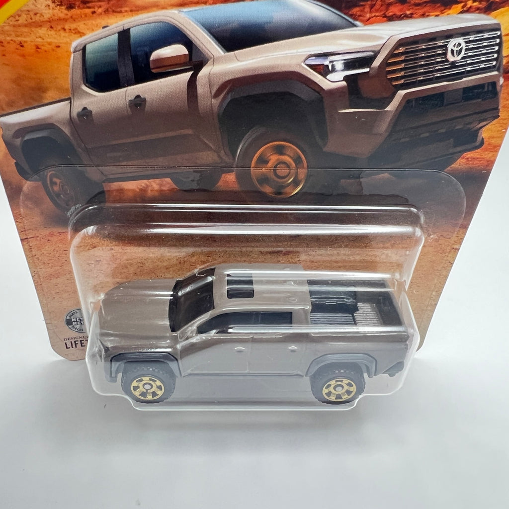 MATCHBOX 2024 TOYOTA TACOMA   2026 MAINLINE  BROWN  43/125