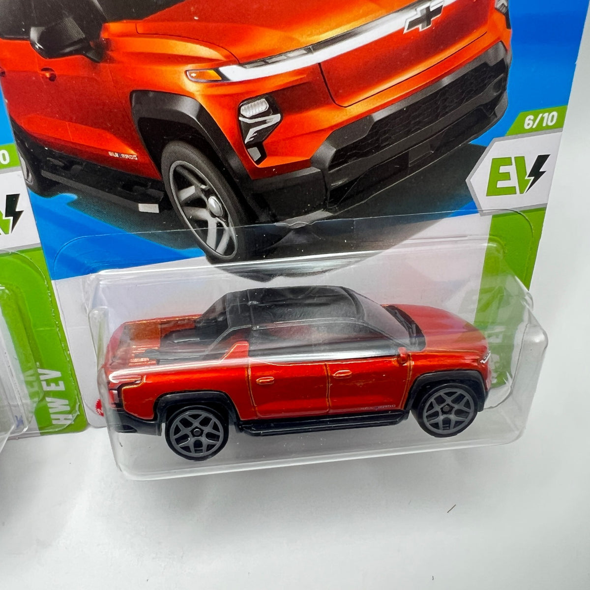 Hot Wheels Silverado EV RST Lot of 2 Silver + Orange 86/250 1:64
